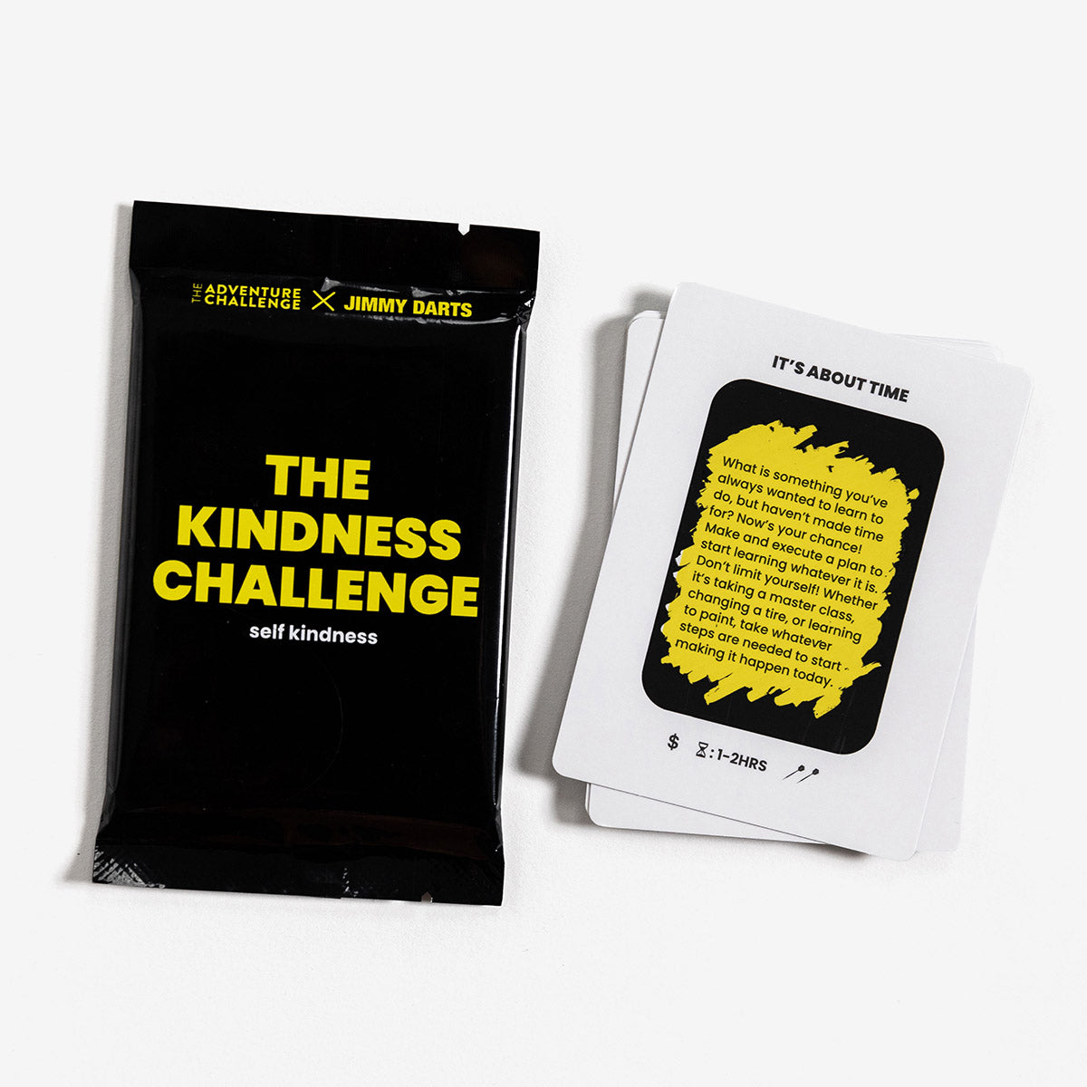 The Kindness Challenge: Self Expanion pack from Jimmy Darts and The Adventure Challenge is 12 scratch-off challenges to help you practice being kind to you! Sample card scratched off next to package.